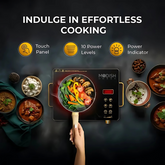 Close-up of the induction cooktop’s LED display and touch-sensitive power and temperature buttons